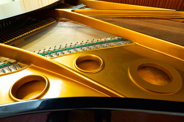 piano deck close view, chords and other parts, grand piano musical instrument