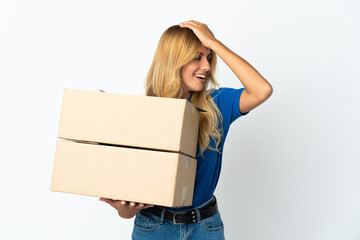 Young blonde Uruguayan delivery woman isolated on white background has realized something and intending the solution