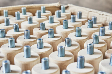 Lathe wooden legs of solid birch with built-in screw pin stacked vertically in a cardboard box...