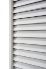 Obraz premium Stylish light wooden blinds in light gray color made of thin plain planks and boards in contemporary carpentry workshop as background close view