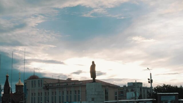 Monument to Vladimir Ilyich Lenin at sunset hyperlapse. Church in the bacjground. No people. High quality FullHD footage