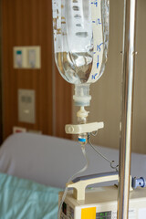 Close-up of intravenous bag on a pole. It is connected to Intravenous lines.