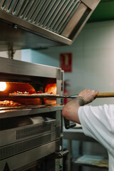 Pizza Into The Oven