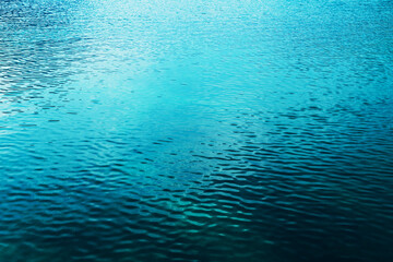Calm blue lake Bohinj water surface