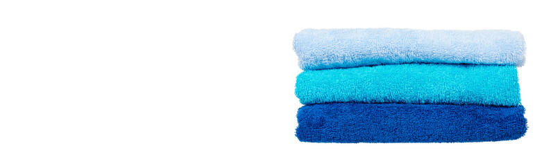 Blue cotton towels isolated on white background.