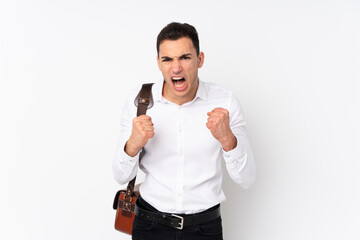 Young handsome businessman on isolated background frustrated by a bad situation