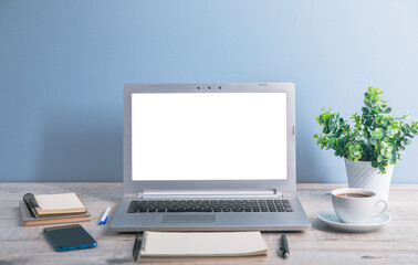 computer with notepad and phone on table