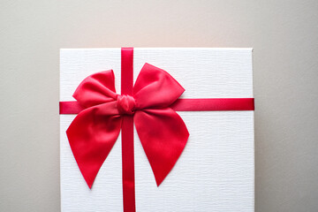 Valentine present. Gift box and red ribbon for romantic couple.Gift box and ribbon with tag for valentine present