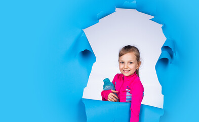 smiling child with water bottle. childhood happiness. pretty teenage girl in sportswear. kid fitness fashion. healthy lifestyle. water balance in body. hydration. feel thirsty and drink