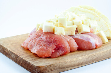 Fresh turkey meat pieces, uncoocked, pink food, healty fillet with celery root vegetable, isolated object, design element