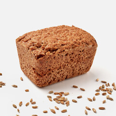 small rye bread on a white plate  pumpkin seeds