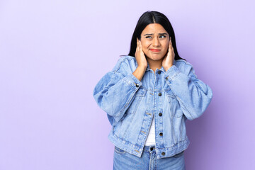 Young latin woman woman over isolated background frustrated and covering ears