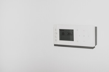 Modern digital programmable Thermostat on a wall