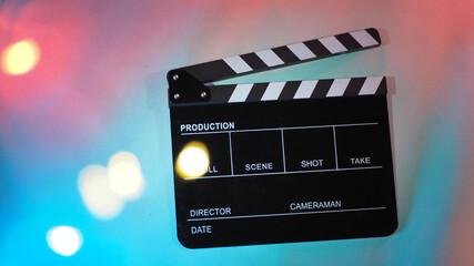 Black Clapperboard or movie clapper board or slate on neon pink peach,blue,Tiffany Blue ,mint green or multi color background..