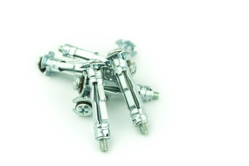 Metal anchor and screw on concrete on a white background