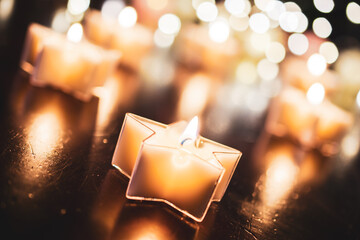 Relaxing Tealight In Star Shape With A Bokeh Of Several Candles
