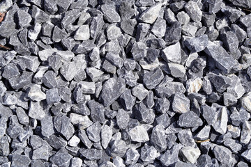 Grit as decorative stones in the garden. Background motif from gray stones. Gravel.