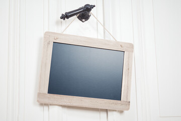 Blank Blackboard With Copy Space On A String Hanging On A Doorhandle
