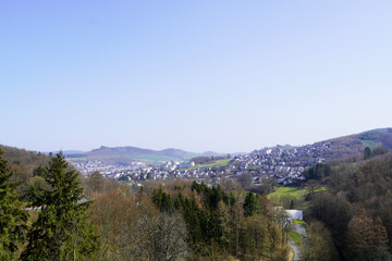 View of the city of Meschede in the Sauerland and the wooded surroundings. Landscape in North Rhine Westphalia. Germany.