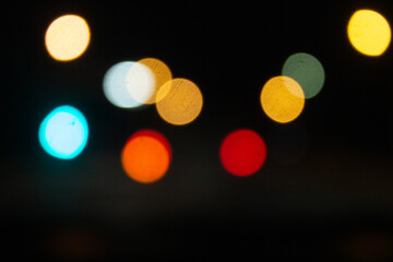 Boke. Photo without focus. Lights on a black background. Defocused Image Of Illuminated Lights At Night