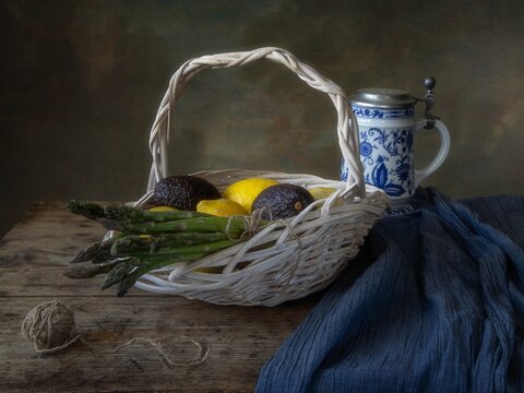 Still life with asparagus and lemons in vintage style