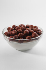 Healthy breakfast ingredients. Breakfast cereal, milk or yogurt glass, white background, copy space