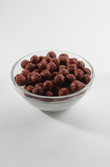 Healthy breakfast ingredients. Breakfast cereal, milk or yogurt glass, white background, copy space