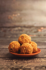 Indian traditional snacks sweet laddu or laddoo
