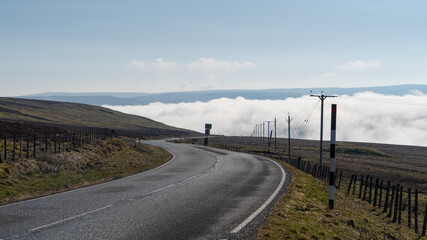 Temperature inversion in Cumbria causing fog to lie in the valley below Hartside, UK