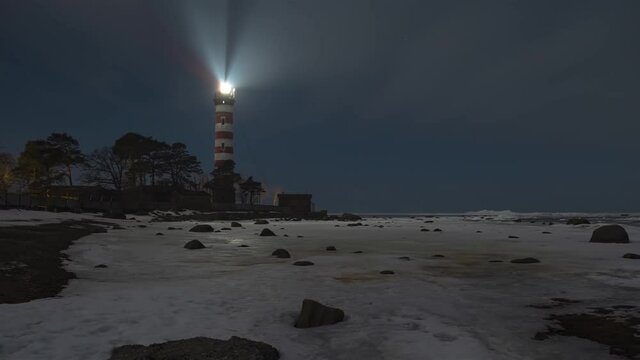 Shepelevsky lighthouse on the southern coast of the Gulf of Finland at night in winter timelapse video