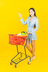 Portrait beautiful young asian woman smile with grocery basket