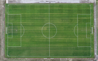 Aerial view of an empty green soccer field. football game