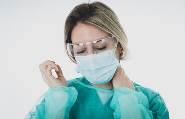 Isolated portrait of depressed and tired female Doctor Nurse Wearing Protective Medical Face Mask