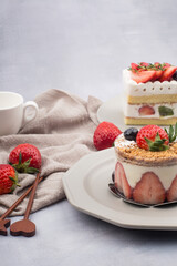 Fresh strawberry cake with cream in close up.