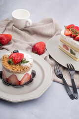 Fresh strawberry cake with cream in close up.