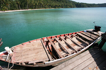 Old wooden row boat on sea
