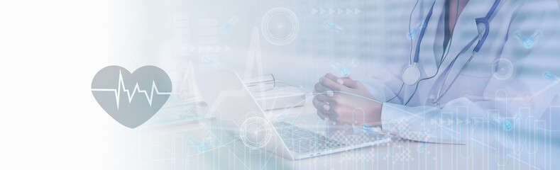 Soft focus-doctor working to laptop computer,online technology marketing business of medical,healthcare,insurance,stock graph and diagram,medical examination analysis report,banner panoramic header