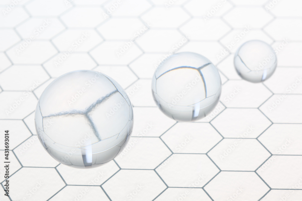 Poster three transparent balls shperes flying on an honeycomb glass pattern with copy space for your text