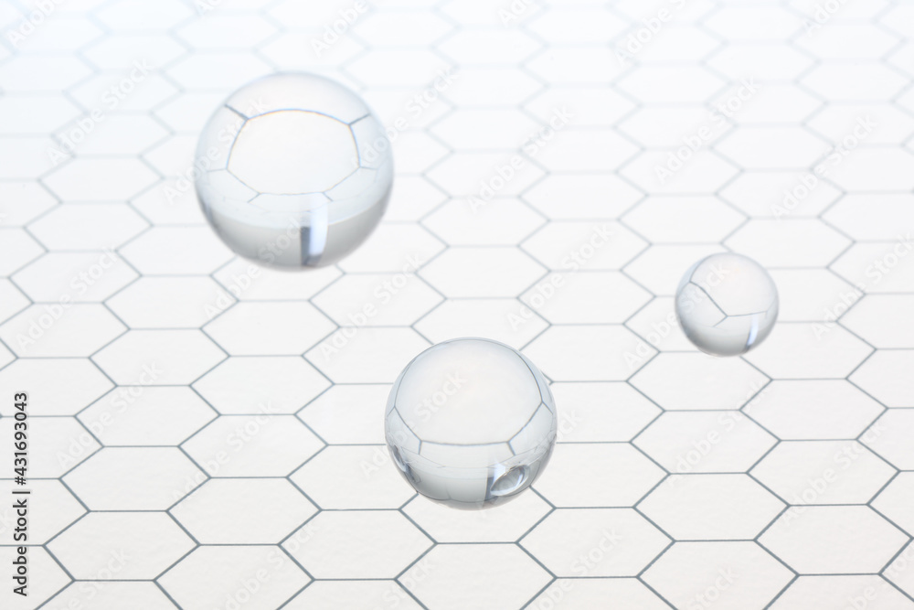 Poster three transparent balls shperes flying on an honeycomb glass pattern with copy space for your text