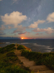 Moonrise and starry night over Long Reef Beach, Sydney, Australia.