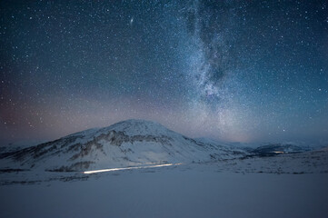 Fototapeta na wymiar A mountain against the Milky Way