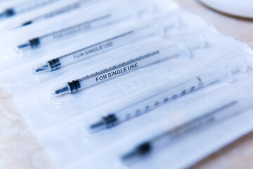 Syringes for single use in a row
