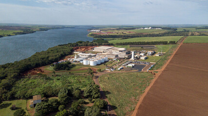 Fototapeta na wymiar Aerial capture of large food industry close to the tiete river.