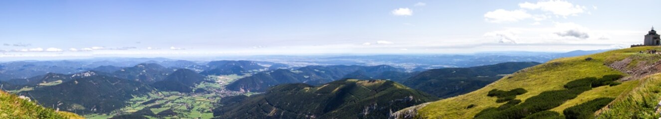 Panorama of alpine mountains in.Puchberg am Schneeberg, Niederösterreich, Austria. View to the church on the hill.
