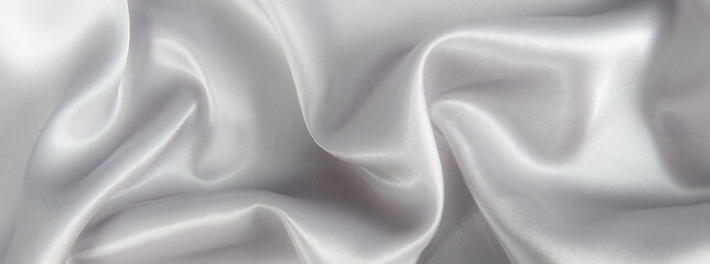 Obraz premium Abstract gray silk fabric texture background. Cloth soft wave. Creases of satin