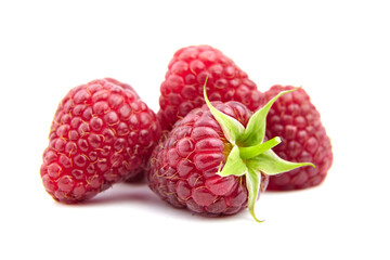 Fresh raspberries isolated on white background. Heap of red raspberries