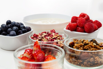 Ingredients for a healthy breakfast. Muesli, berries and yogurt. Healthy eating. Sports fitness menu. Concept. High quality photo
