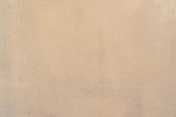 Fototapeta na wymiar Texture of old beige plaster wall. Background