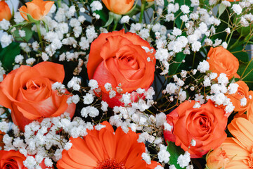 Floral chest with mini rose, colorful roses and gerbera.