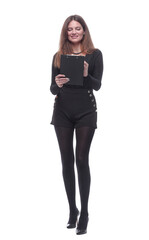 in full growth. young woman making notes in the clipboard.